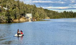 small boat approaching island